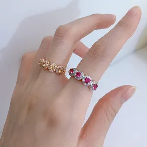 Detail shot of sparkling S925 silver dual-ring set featuring colorful cubic zirconia stones.