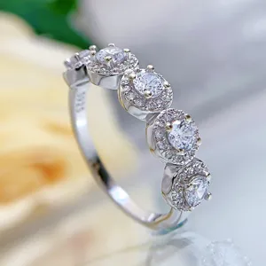 Detailed close-up view of a sparkling S925 silver ring, elegant multi-stone halo design.