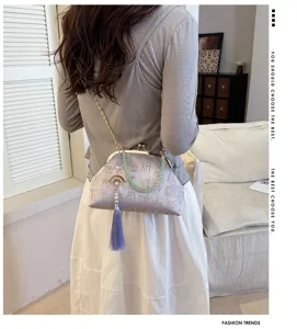 Elegant Chinese style kiss-lock clutch bag with jade bead strap and tassel pendant.