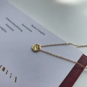Gold S925 silver small round pendant necklace featuring delicate chain and lucky letter engraving.