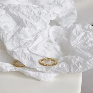 Elegant 925 silver gold-plated star diamond rings set on minimalist white paper background.