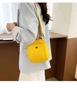 Stylish yellow crossbody shell bag, versatile shoulder handbag for women daily casual wear style.
