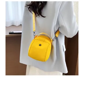 Yellow shoulder crossbody shell bag, versatile daily handbag with adjustable strap.
