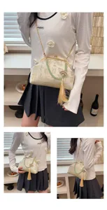 Vintage Chinese style jacquard shoulder bag detail with elegant jade tassel and chain.