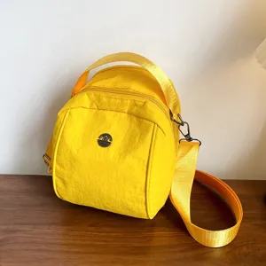 Yellow nylon crossbody shoulder bag, stylish casual shell handbag for women daily wear.