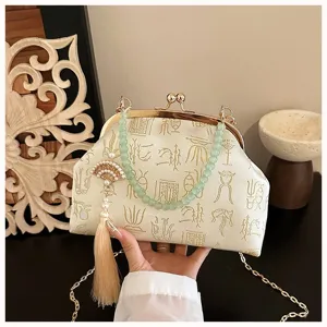 Chinese style jacquard evening bag with pearl bead handle and tassel pendant for women.