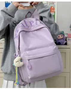 Large capacity Japanese style school backpack for students, chic purple design with front pocket.