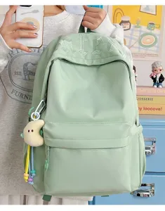 Minimalist Japanese style large capacity student school backpack in trendy light green color.