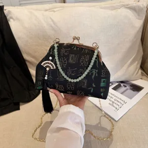 Chinese style vintage kiss-lock evening shoulder bag with jade beads and tassel.