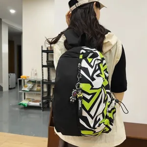 Trendy black green colorblock backpack for students, large capacity geometric school bag.