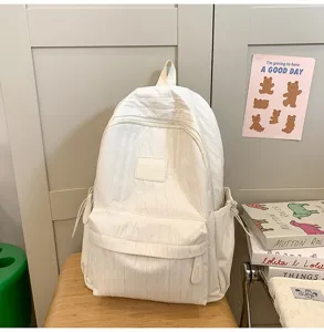 Minimalist white casual backpack for students and travel, lightweight daily daypack detail view.