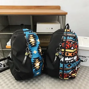 Casual geometric graffiti splicing backpack for men and women, large capacity travel school bag.