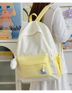 Star print student backpack detail, showing fresh yellow design, large capacity and casual style.