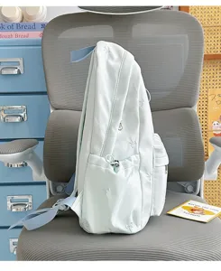 Korean minimalist mint green student backpack with cute bow embroidery, lightweight casual bag.