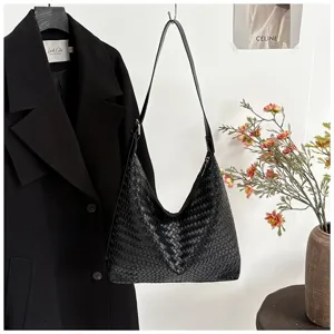 Black woven shoulder bag, premium leather hobo bag, stylish daily commuting handbag.