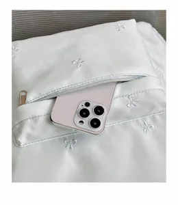 Student casual school backpack minimalist solid color bow embroidery pocket detail view