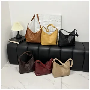 Casual large capacity woven shoulder bag for women, stylish commuting tote and underarm bag.