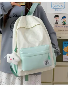 Mint green and white star pattern school backpack detail view, casual canvas bookbag.
