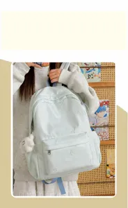 Mint green student school backpack with cute bow embroidery, lightweight casual daypack.