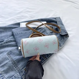 Chic casual pillow shoulder bag with bow print and contrast brown straps for summer fashion.