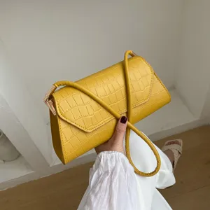 Gelbe Baguette-Umhängetasche mit Krokodilmuster für Damen, stilvolle Kunstleder-Handtasche.