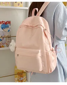 Korean style pink student casual school backpack with cute bow embroidery for daily and school use.
