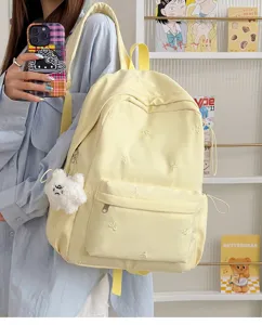Light yellow student backpack with cute bow embroidery, casual casual daypack for school.