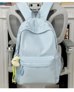 Light blue minimalist school backpack with cute moon pendant and stylish embroidery details.