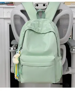 Light green minimalist student backpack large capacity school bag with chic embroidery charm.