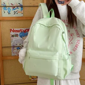Lightweight casual student backpack with bow embroidery, minimalist solid color daily bookbag.