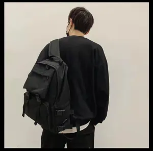 Casual black travel backpack for men and women, multi-pocket workwear school bookbag.