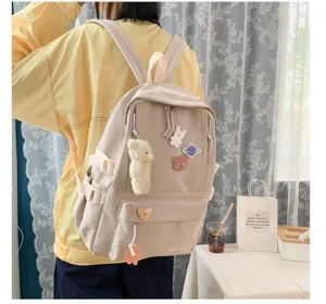 Mochila de lona beige estilo Harajuku con colgante de oso lindo y gran capacidad para estudiantes.
