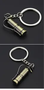 Detailed view of creative mini fire extinguisher metal keychain, vintage style accessory.
