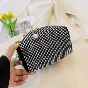 Elegant black rhinestone evening bag with chic pearl clasp and stylish metal chain strap.