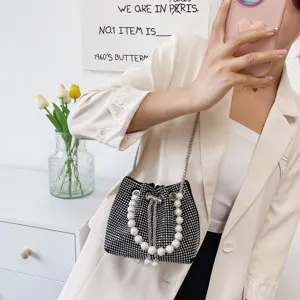 Black rhinestone bucket bag with pearl handle and metal chain for women fashion style.