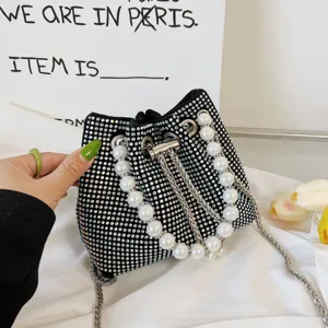 Black rhinestone bucket bag with pearl chain strap, luxury sparkling crossbody handbag.