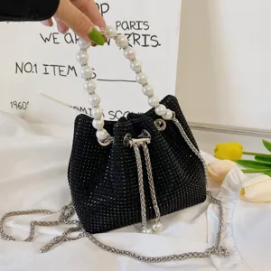 Black rhinestone bucket bag with pearl handle and silver chain strap for women fashion.