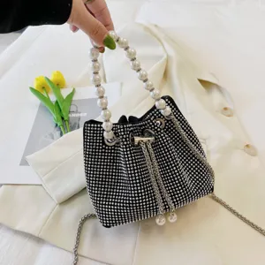 Exquisite black rhinestone bucket bag featuring elegant faux pearl handle and chic metal chain.
