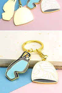 Mini swimming goggles and cap keychain, metal enamel souvenir pendant for sports fans.