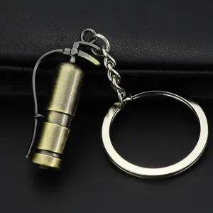 Mini metal fire extinguisher keychain, creative vintage bronze keyring for daily use.
