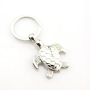 Metal turtle keychain with a sturdy round ring and shiny silver finish for car keys.