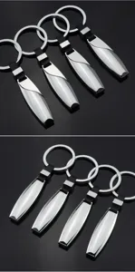 Sleek polished metal keychain with dual split rings and black strap for car keys.
