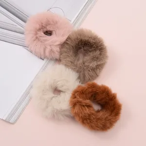 Fluffy faux fur hair scrunchy detail view, soft plush hair tie for cute autumn winter styling.
