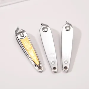 Detail view of stainless steel slanted nail clippers with gold floral and silver design.
