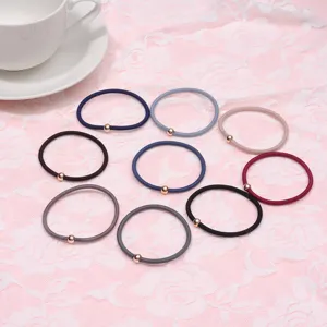 Minimalist elastic hair ties set with small metal bead detail, stylish hair accessories.