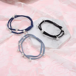 Minimalist solid color pearl hair tie detail, elegant elastic hair accessory for women.