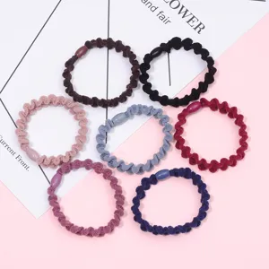 Detailed view of colorful wavy rubber hair ties, elastic hair ropes for daily styling.