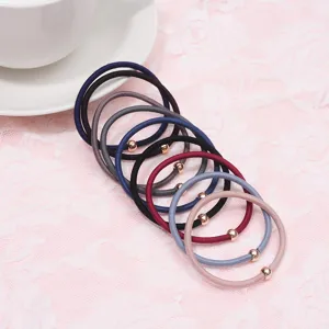 Detail view of stylish multi-color hair ties with cute metal beads, perfect for daily wear.