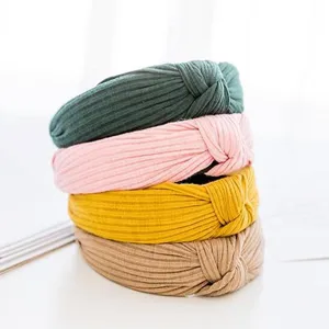 Detailed view of the soft ribbed fabric knotted headbands in multiple colors for women.