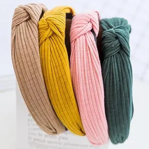 Detailed view of knotted fabric headbands in multiple vibrant colors for daily wear.